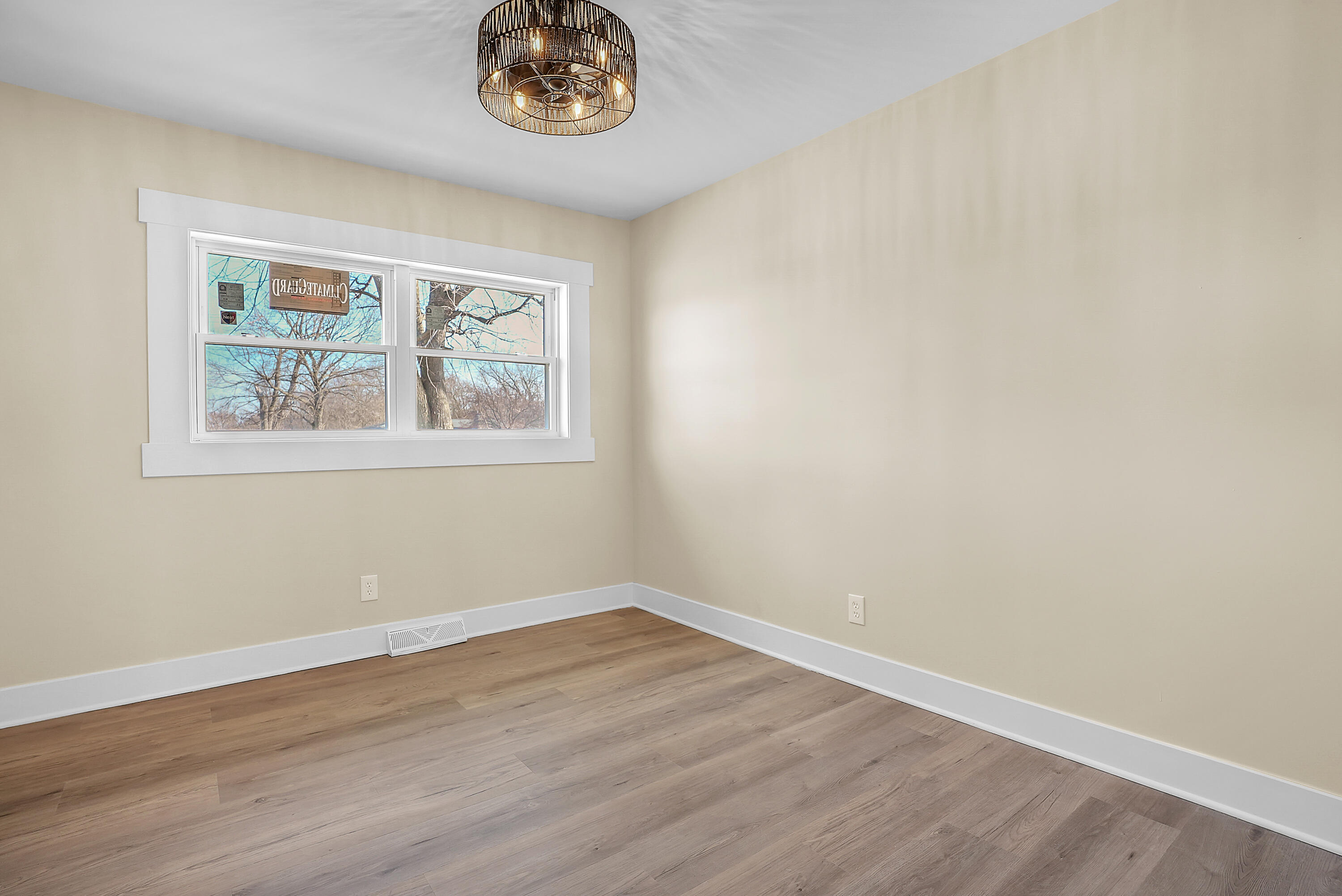 1952 Hayes Leonard Road Valparaiso, IN 46385 - Photo 13 of 42 a view of an empty room with wooden floor and a window