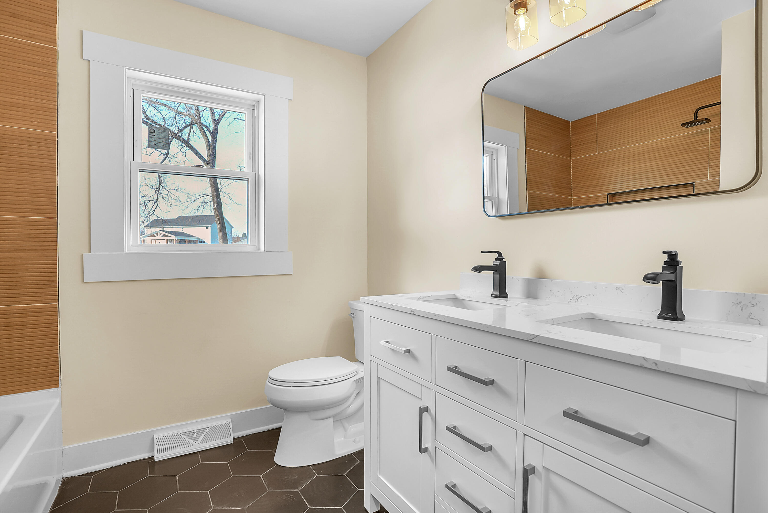 1952 Hayes Leonard Road Valparaiso, IN 46385 - Photo 14 of 42 a bathroom with a granite countertop sink mirror vanity and toilet