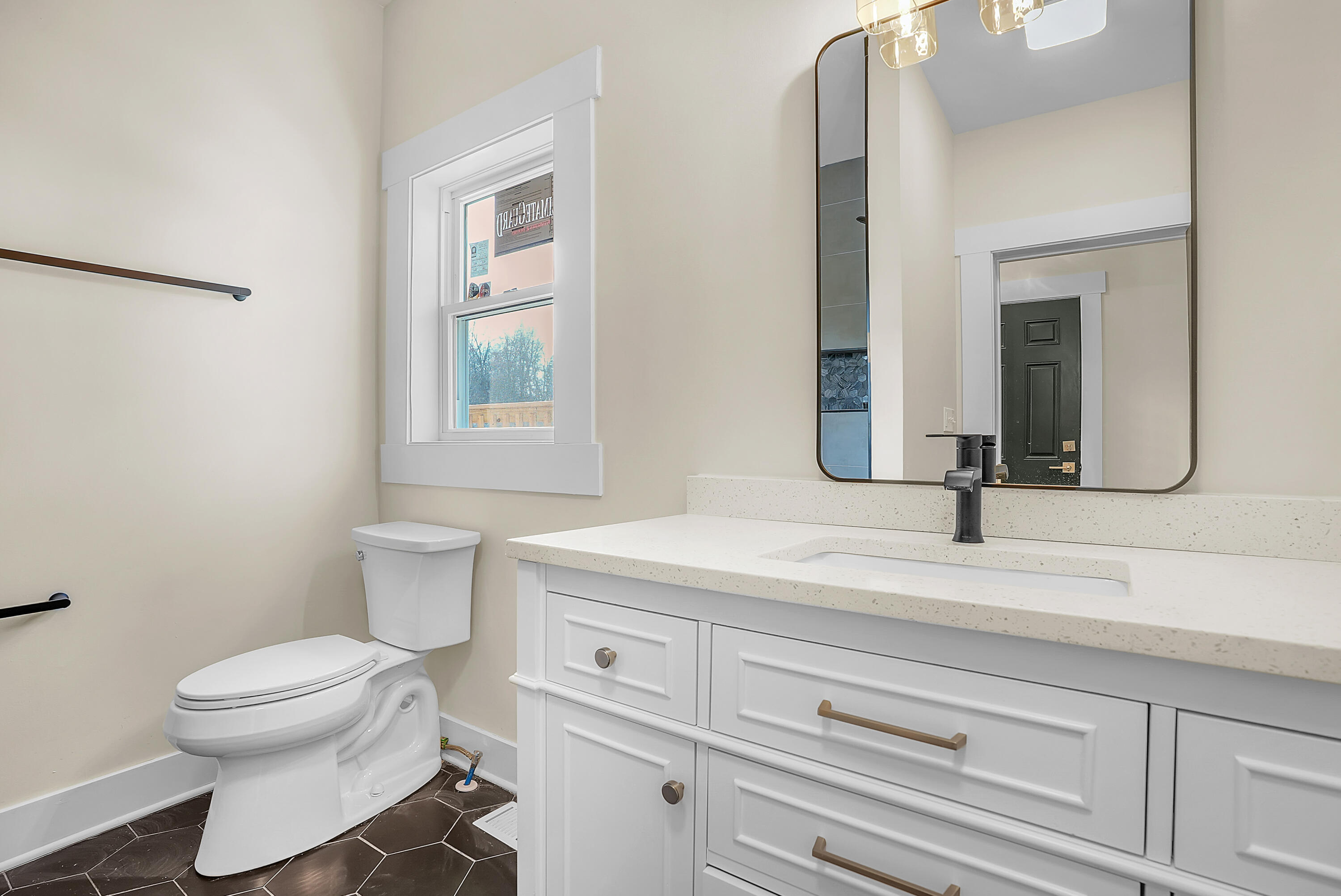 1952 Hayes Leonard Road Valparaiso, IN 46385 - Photo 20 of 42 a bathroom with a toilet sink and mirror