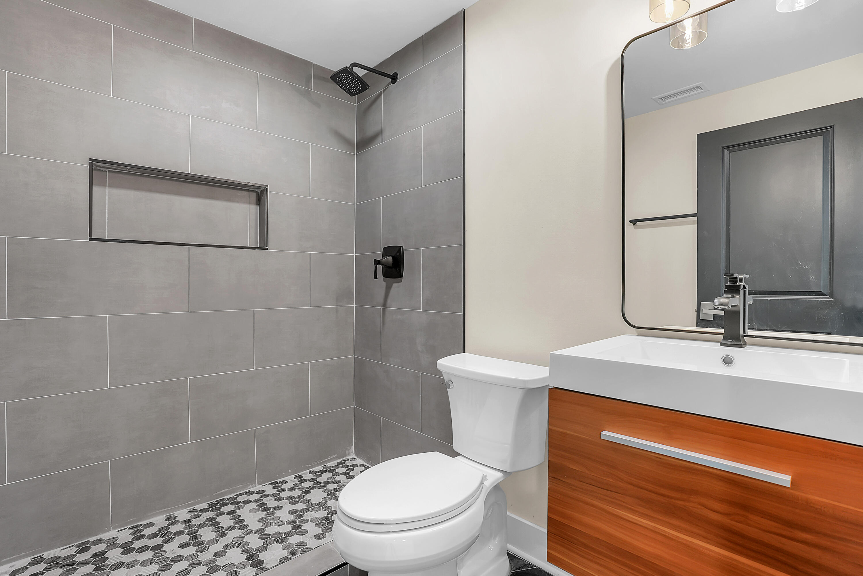 1952 Hayes Leonard Road Valparaiso, IN 46385 - Photo 27 of 42 a bathroom with a sink a toilet and shower