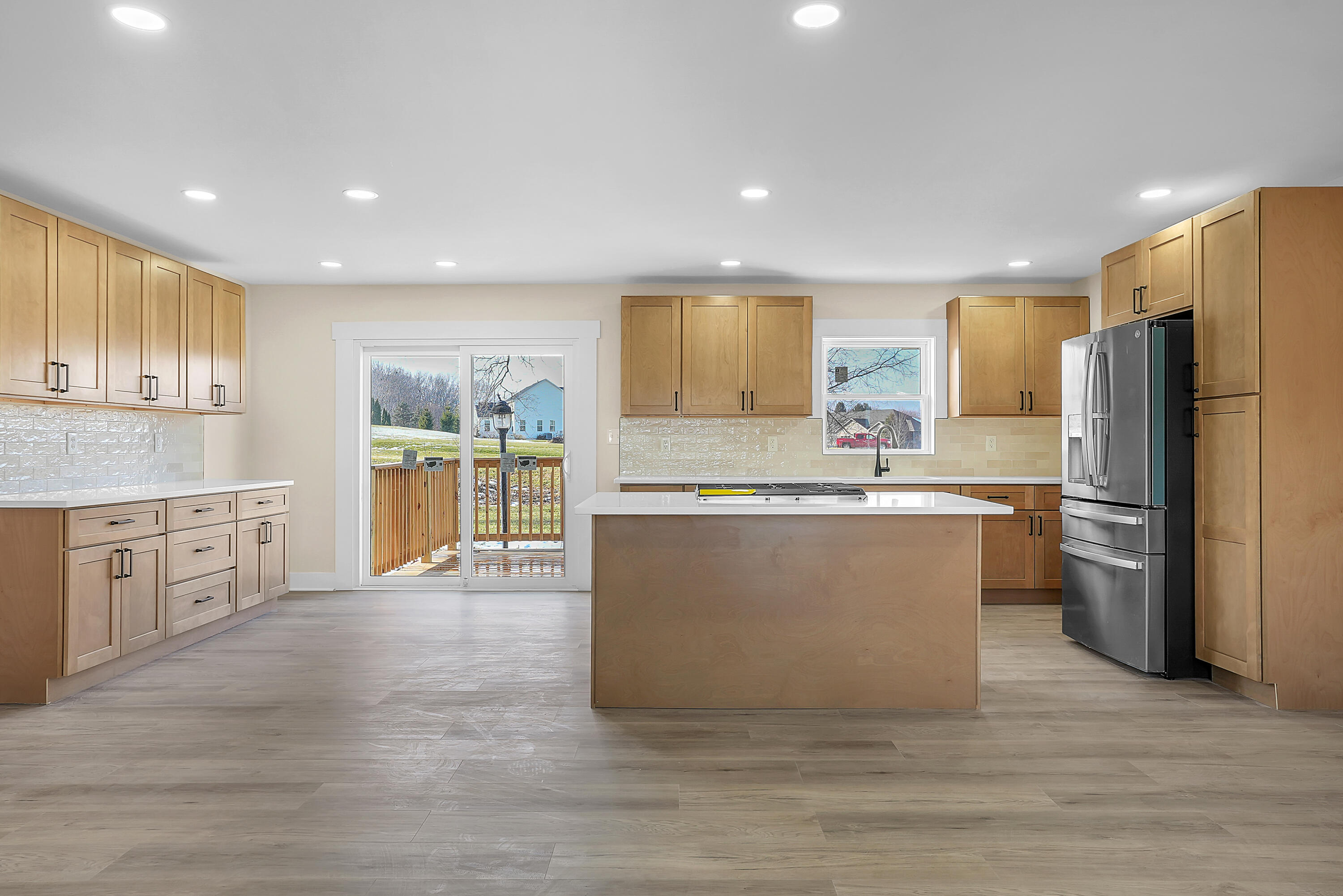 1952 Hayes Leonard Road Valparaiso, IN 46385 - Photo 41 of 42 a large kitchen with kitchen island a sink a center island stainless steel appliances and a cabinets