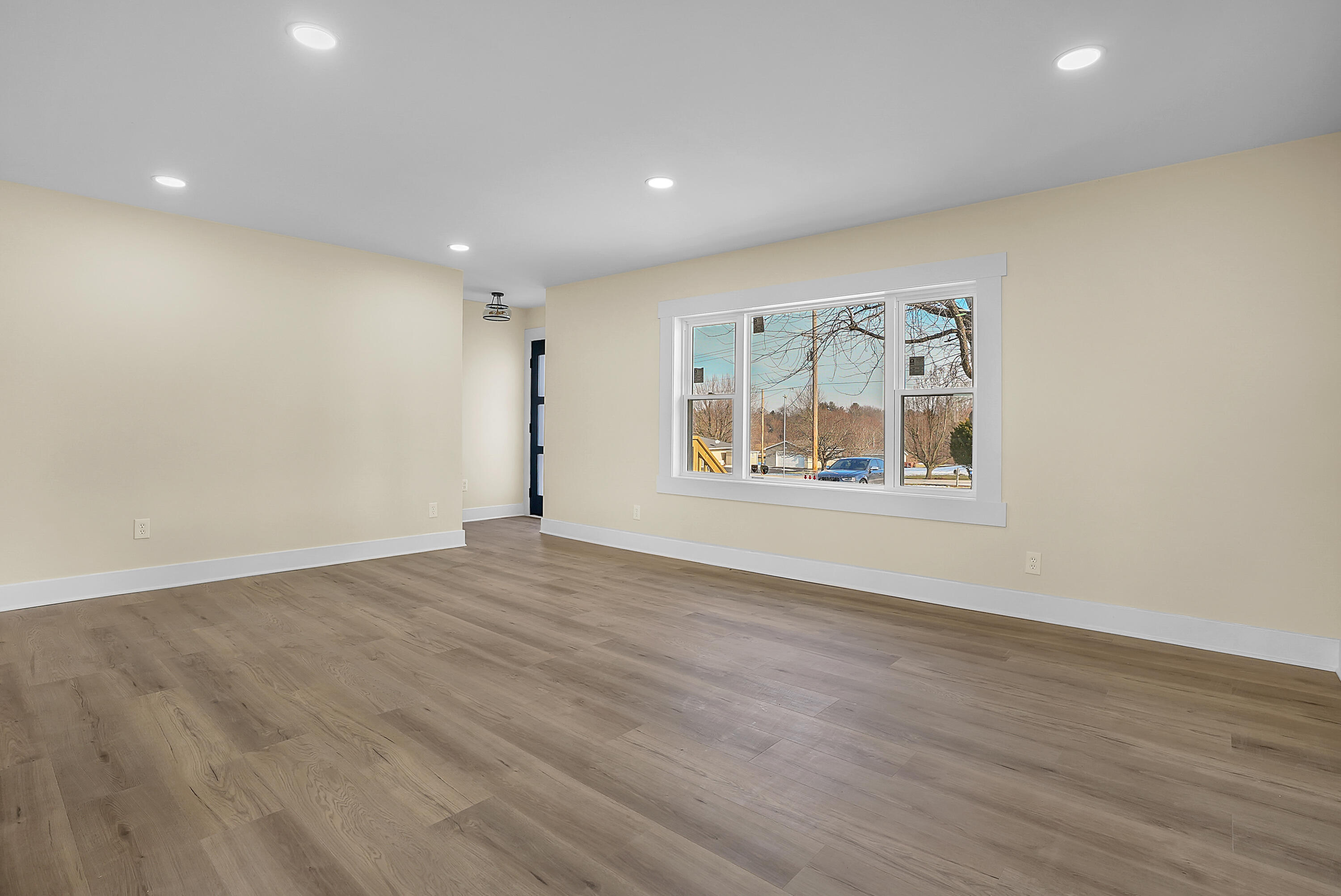 1952 Hayes Leonard Road Valparaiso, IN 46385 - Photo 5 of 42 an empty room with wooden floor and window
