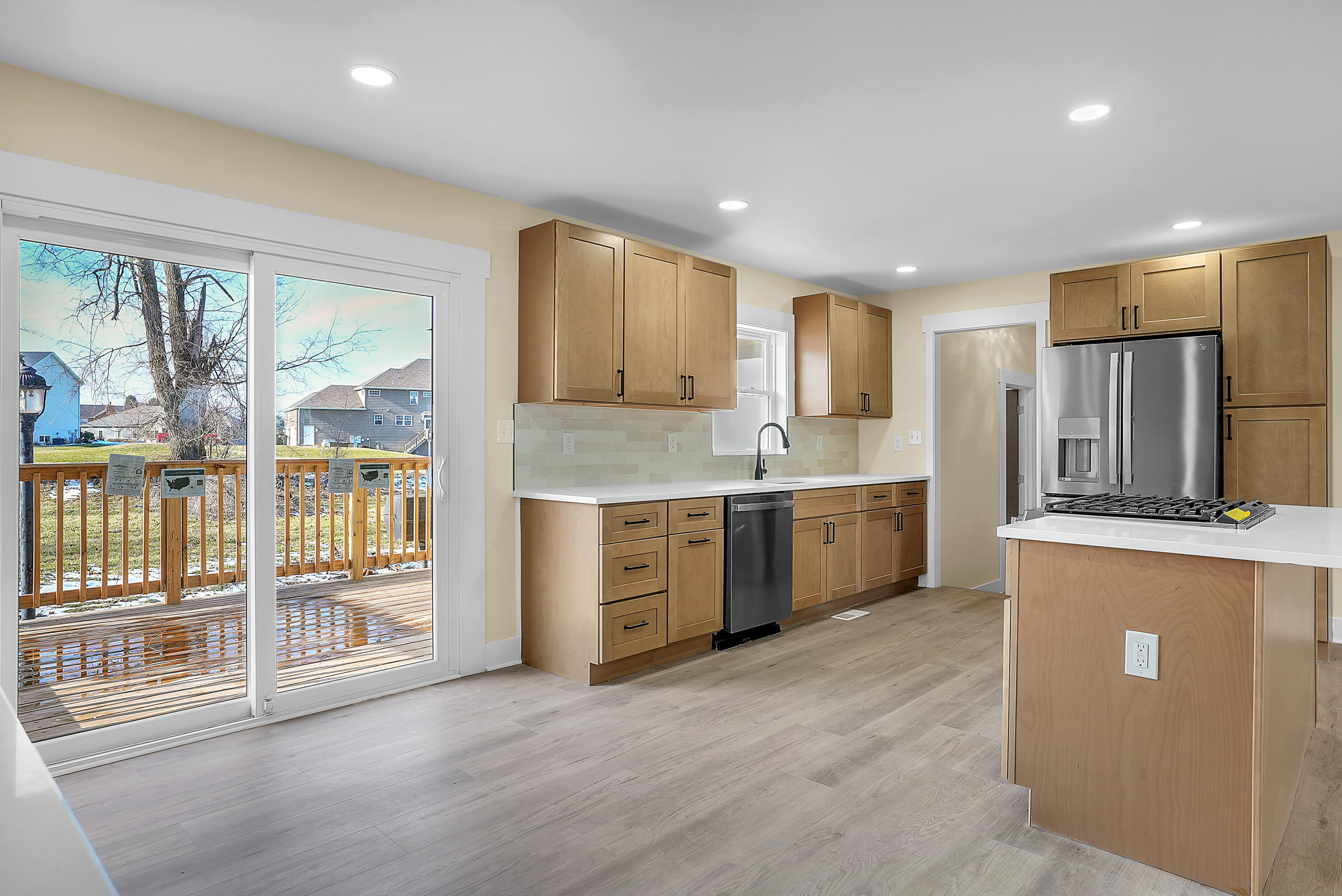 1952 Hayes Leonard Road Valparaiso, IN 46385 - Photo 9 of 42 a large kitchen with stainless steel appliances double vanity and a large window