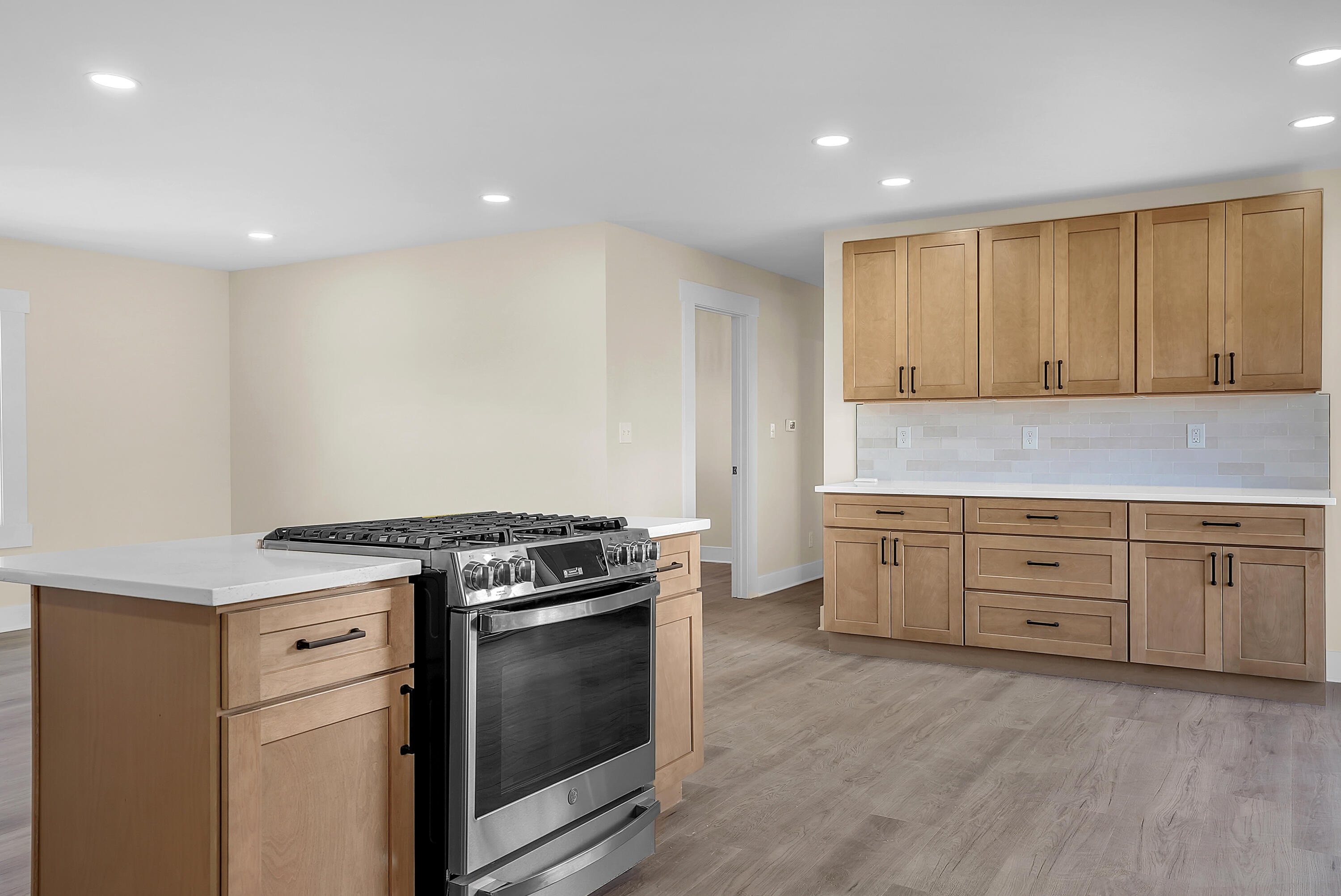 1952 Hayes Leonard Road Valparaiso, IN 46385 - Photo 10 of 42 a kitchen with granite countertop cabinets stainless steel appliances and a wooden floor