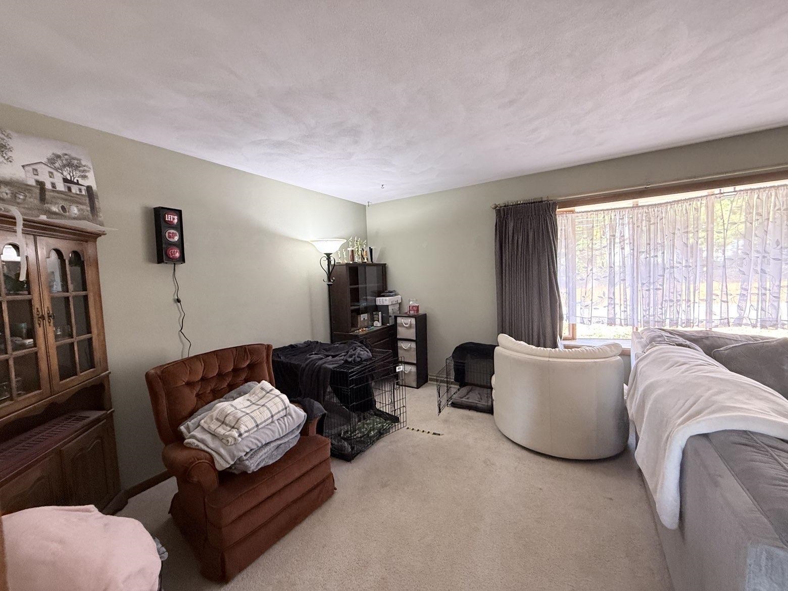 214 South Long Street Warren, IL 61087 - Photo 8 of 28 a living room with furniture and a flat screen tv