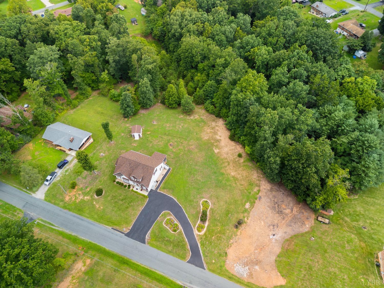 615 Spring Street Hurt, VA 24563 - Photo 54 of 63 an aerial view of a pool yard swimming pool and outdoor seating