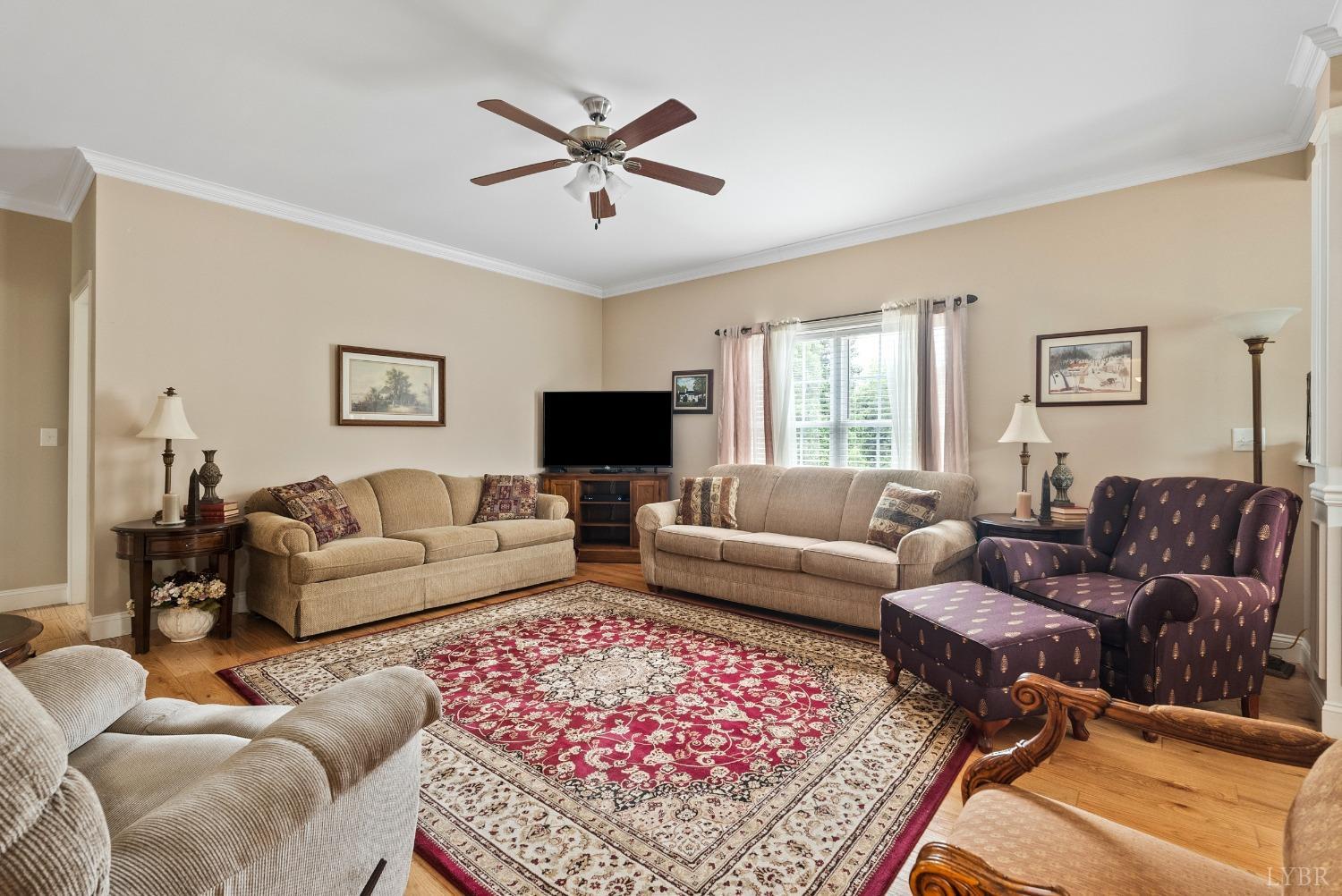615 Spring Street Hurt, VA 24563 - Photo 8 of 63 a living room with furniture a rug and a window