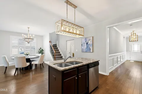 a kitchen with lots of counter top space and dining table