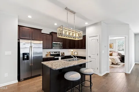 a view of kitchen island with furniture and wooden floor