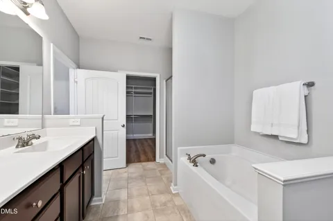 a bathroom with a sink double vanity and a mirror