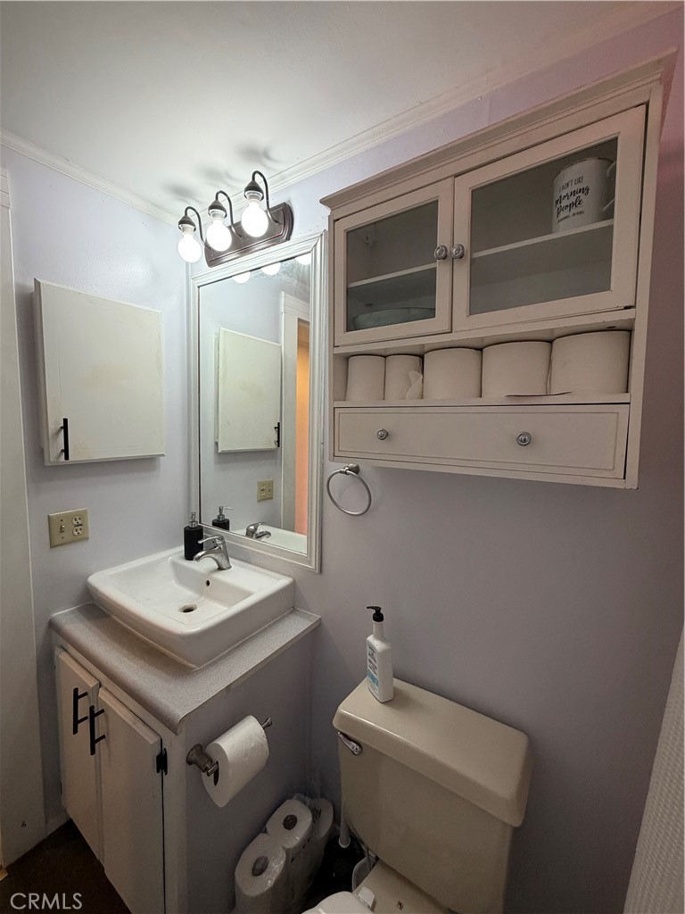 4047 Foothill Drive Lucerne, CA 95458 - Photo 56 of 75 a bathroom with a sink toilet and mirror