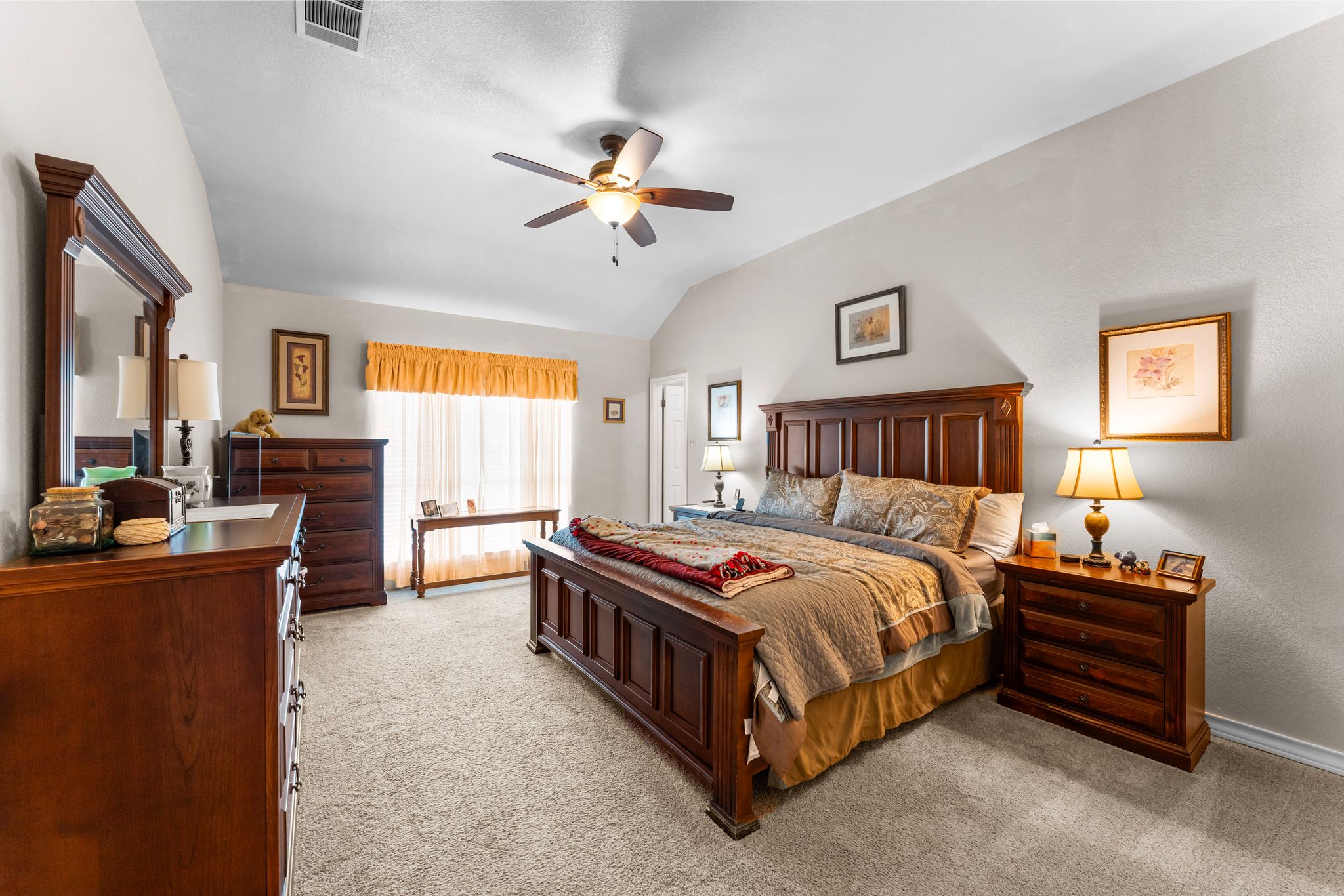 221 Breakaway Road Cedar Park, TX 78613 - Photo 29 of 40 Primary bedroom featuring light colored carpet, vaulted ceiling, ceiling fan, and baseboards