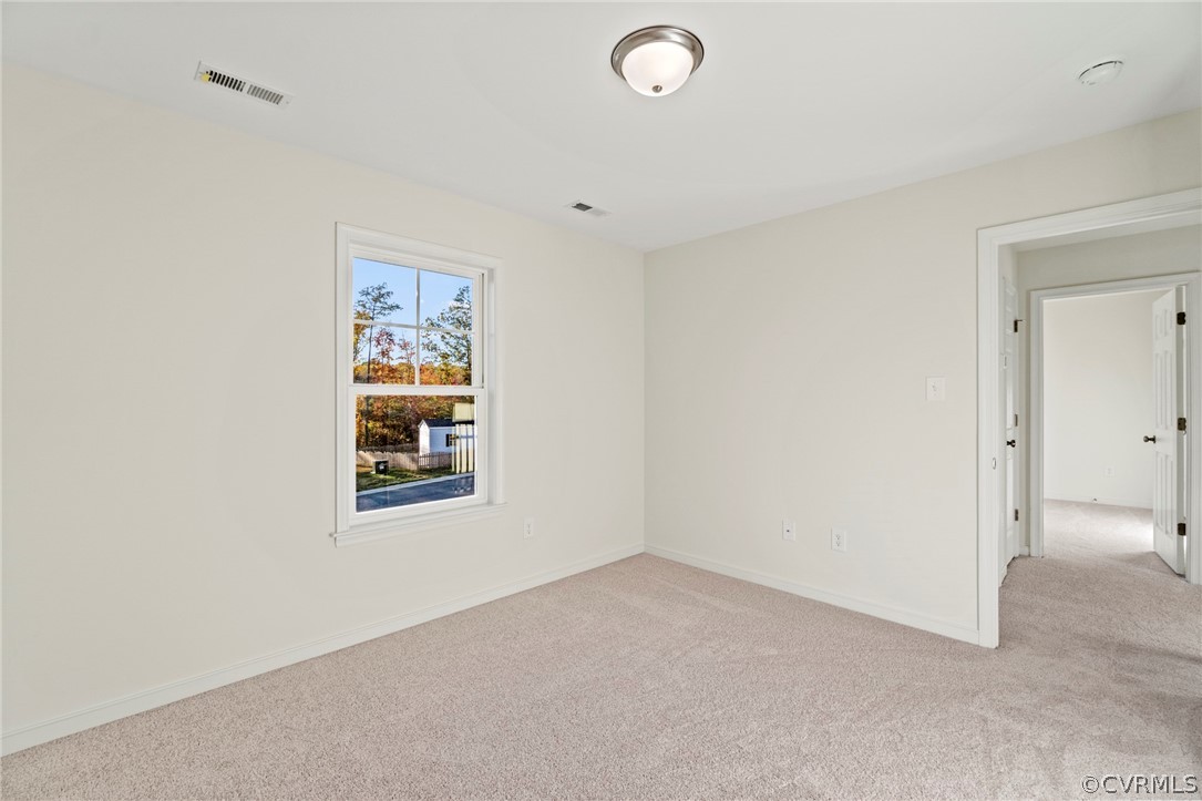 211 Edwin Circle Aylett, VA 23009 - Photo 18 of 48 an empty room with windows