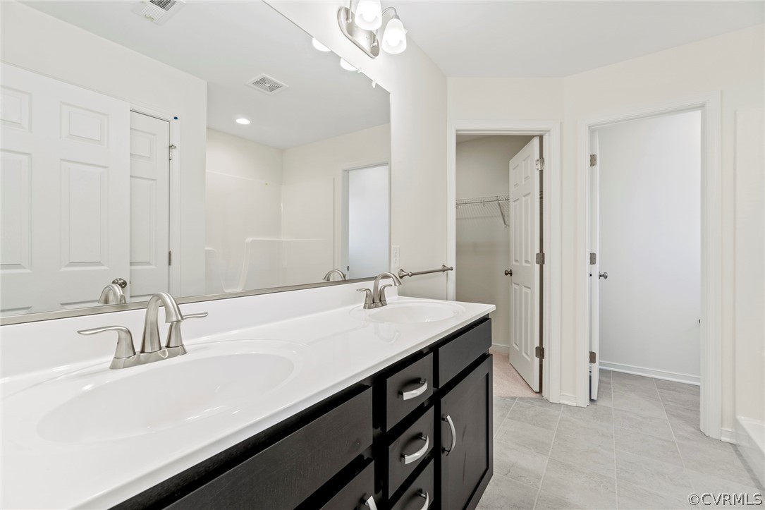 211 Edwin Circle Aylett, VA 23009 - Photo 22 of 48 a bathroom with a sink and a mirror