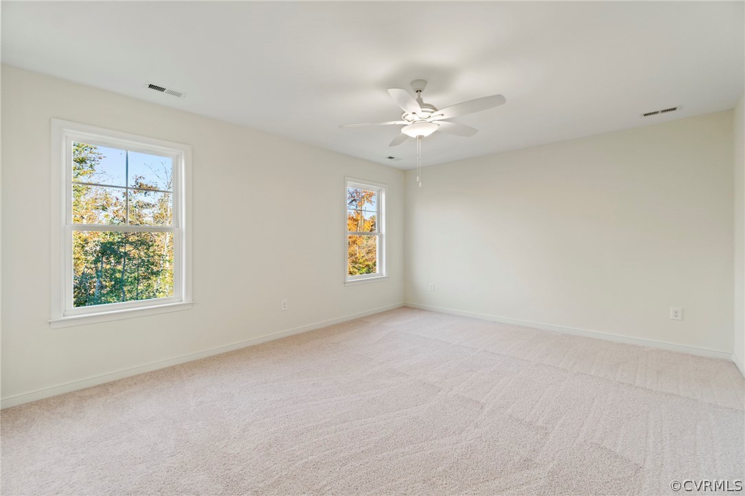 211 Edwin Circle Aylett, VA 23009 - Photo 25 of 48 an empty room with windows and fan