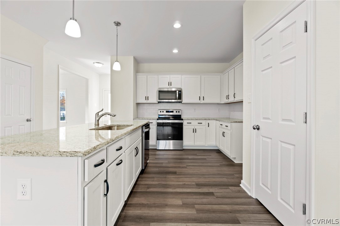 211 Edwin Circle Aylett, VA 23009 - Photo 32 of 48 a large kitchen with granite countertop lots of counter space and wooden floor