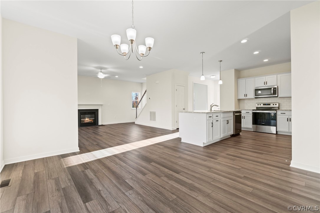 211 Edwin Circle Aylett, VA 23009 - Photo 33 of 48 a large kitchen with stainless steel appliances granite countertop a large counter top and oven a sink with dishwasher