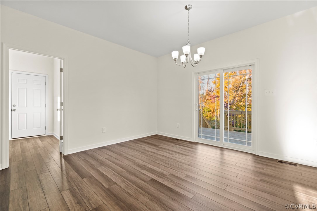 211 Edwin Circle Aylett, VA 23009 - Photo 34 of 48 a view of an empty room with wooden floor and a window