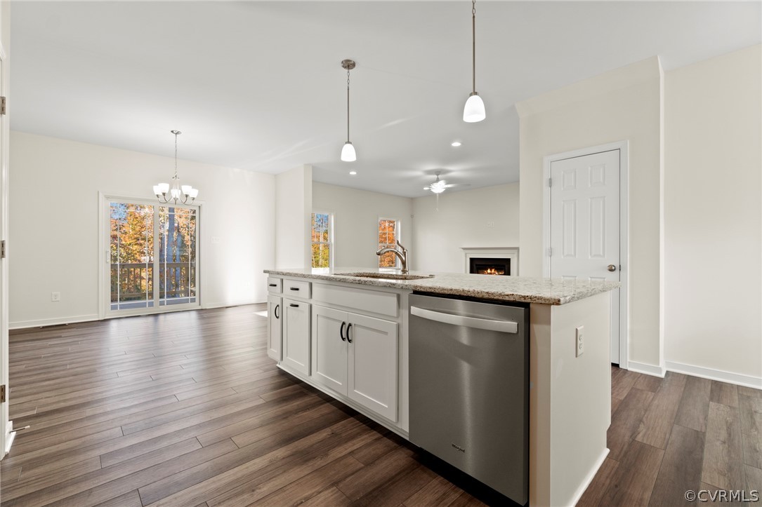 211 Edwin Circle Aylett, VA 23009 - Photo 35 of 48 a kitchen with stainless steel appliances granite countertop a sink a stove a refrigerator and white cabinets with wooden floor
