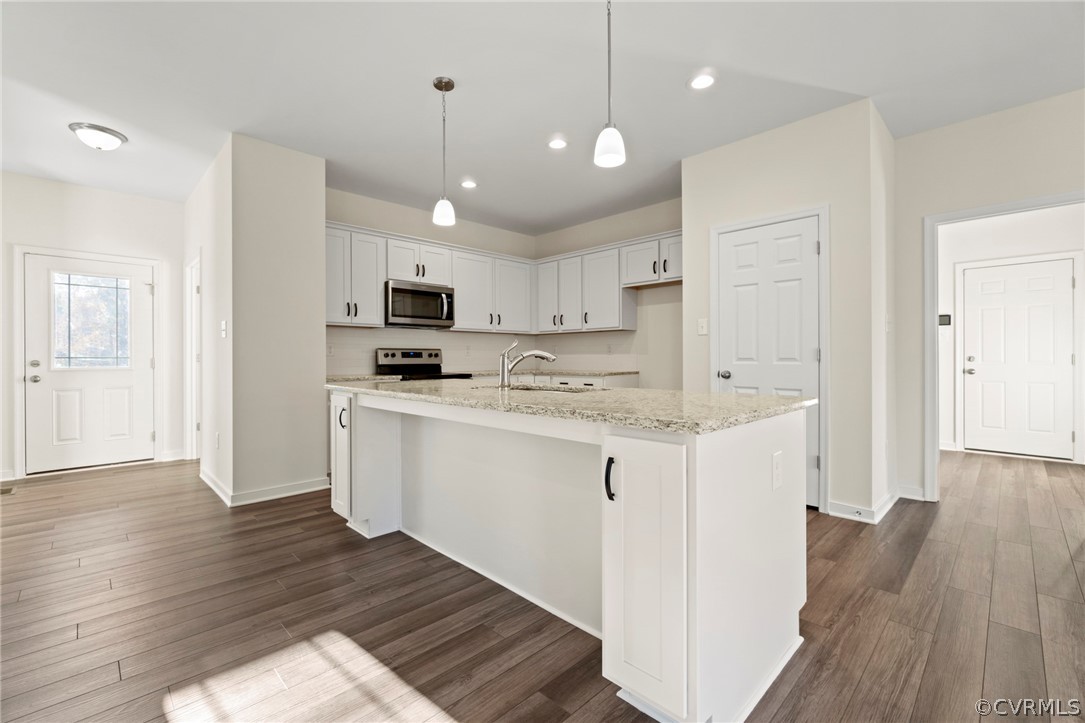 211 Edwin Circle Aylett, VA 23009 - Photo 37 of 48 a kitchen with granite countertop a sink cabinets and wooden floor