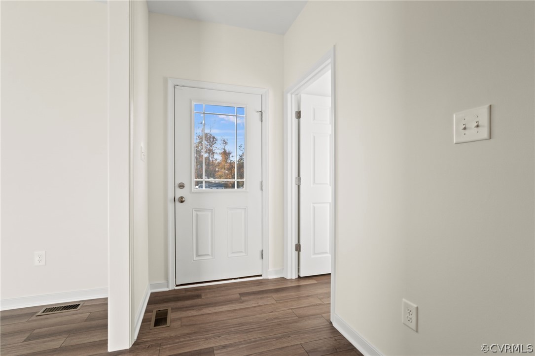 211 Edwin Circle Aylett, VA 23009 - Photo 43 of 48 a view of a hallway with wooden floor