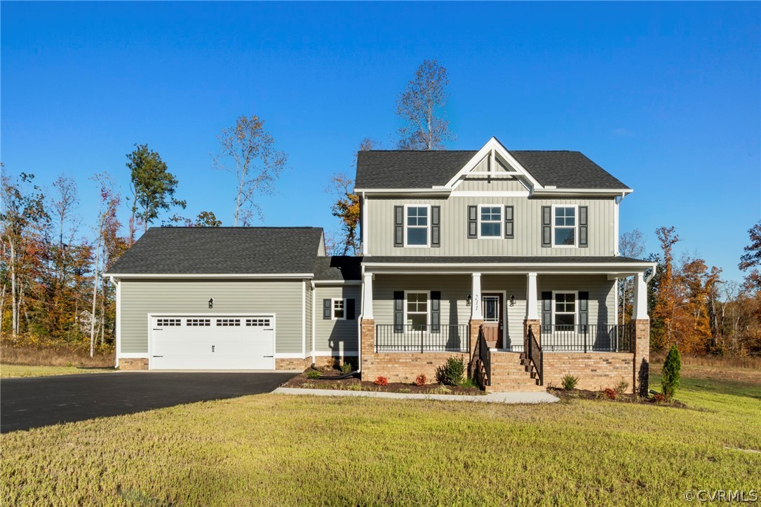 211 Edwin Circle Aylett, VA 23009 - Photo 46 of 48 a front view of a house with a yard