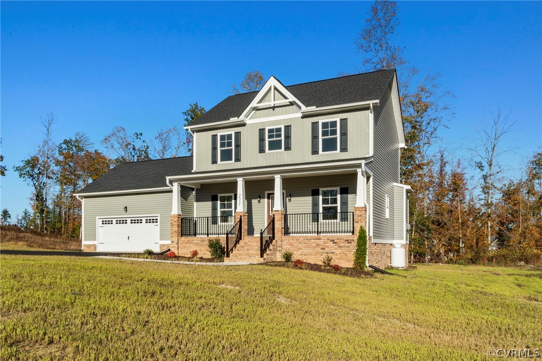 211 Edwin Circle Aylett, VA 23009 - Photo 48 of 48 a front view of a house with a yard