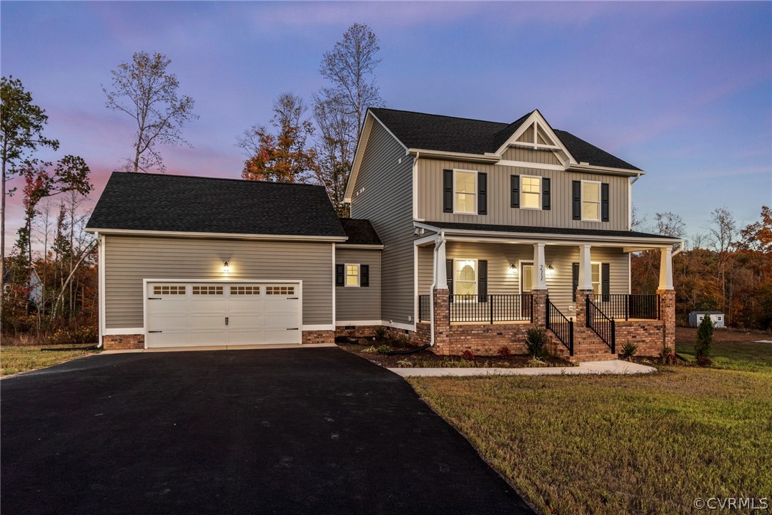 211 Edwin Circle Aylett, VA 23009 - Photo 7 of 48 a front view of a house with garden