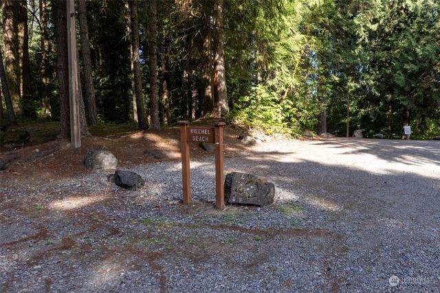 an aerial view of a house with swimming pool and sitting area