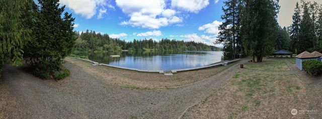 a view of a lake with a big yard