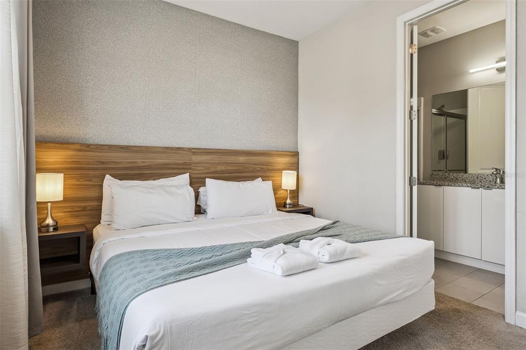 8008 Formosa Valley Place Kissimmee, FL 34747 - Photo 14 of 55 a large white bed in a white room