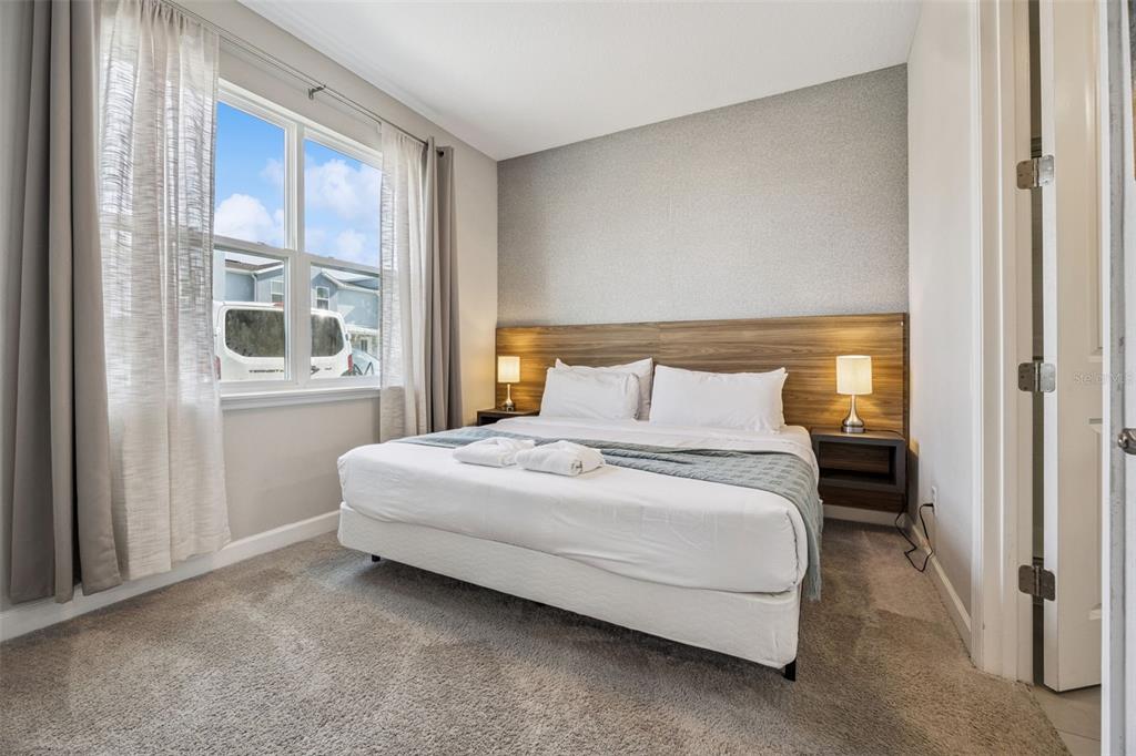 8008 Formosa Valley Place Kissimmee, FL 34747 - Photo 15 of 55 a bedroom with a bed and a window