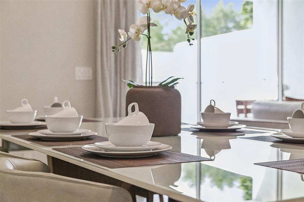 8008 Formosa Valley Place Kissimmee, FL 34747 - Photo 29 of 55 a dining room with table and chairs