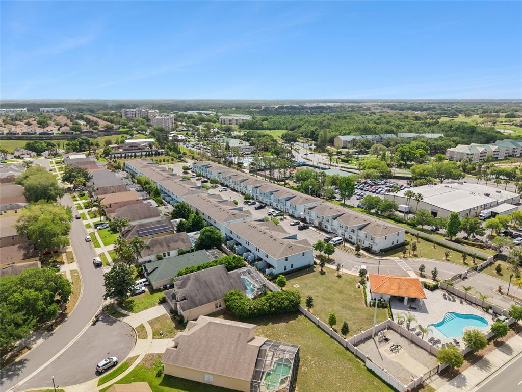 8008 Formosa Valley Place Kissimmee, FL 34747 - Photo 42 of 55 an aerial view of a city with lots of residential buildings