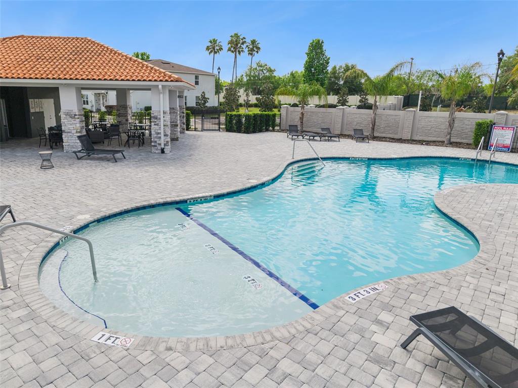8008 Formosa Valley Place Kissimmee, FL 34747 - Photo 44 of 55 swimming pool view with a seating space