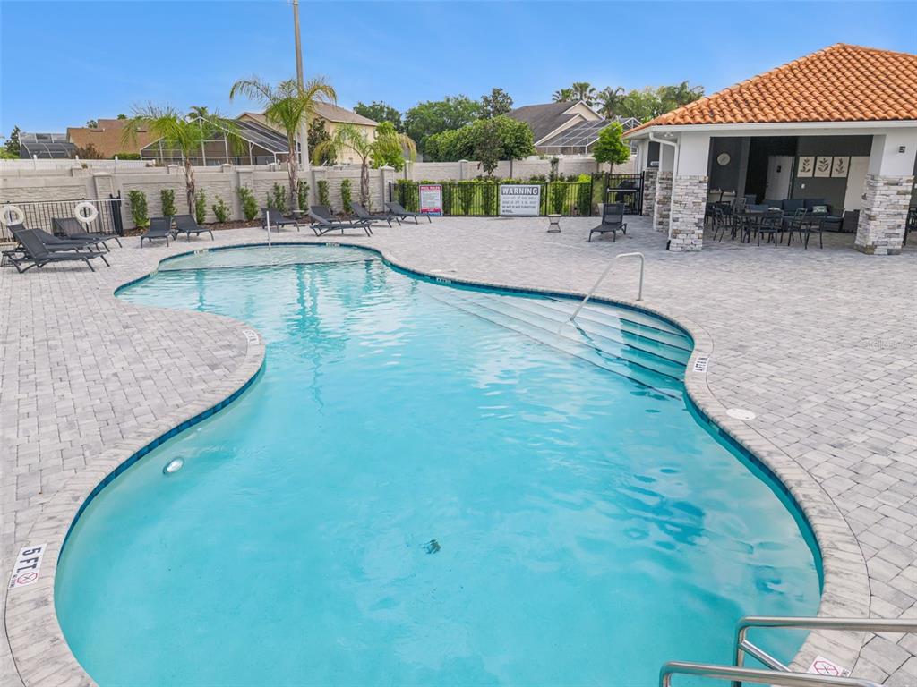 8008 Formosa Valley Place Kissimmee, FL 34747 - Photo 45 of 55 an outdoor space with swimming pool and furniture