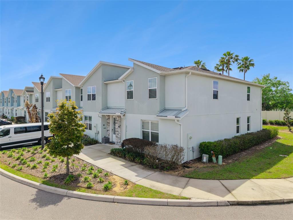 8008 Formosa Valley Place Kissimmee, FL 34747 - Photo 54 of 55 a front view of a house with a yard