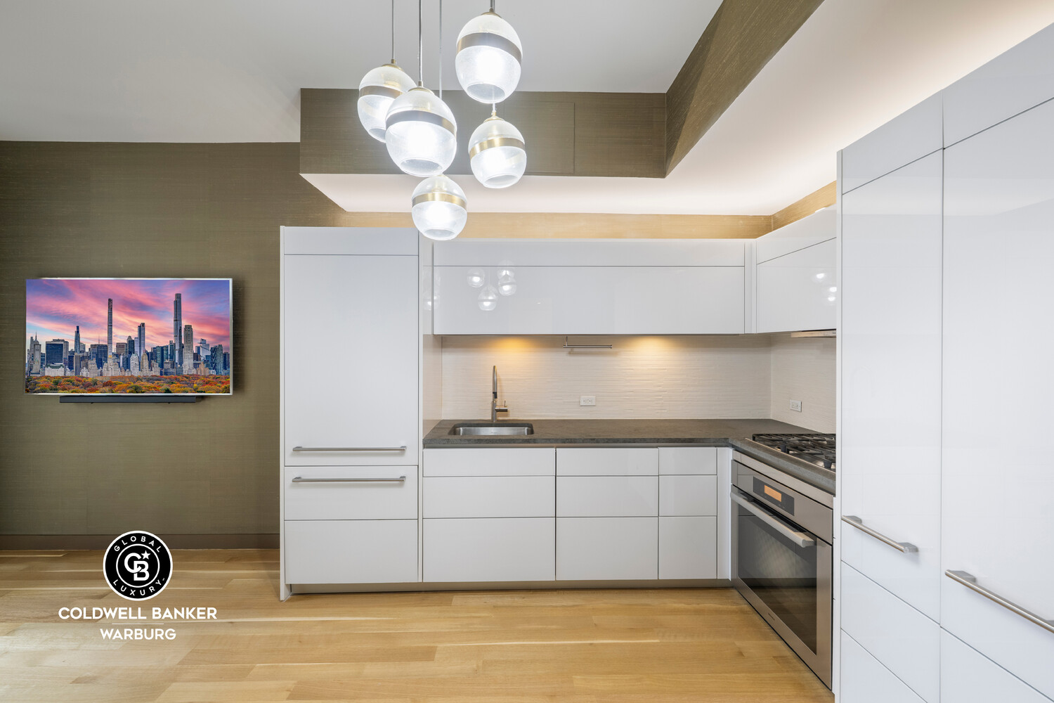 241 5th Avenue, Unit 14C Manhattan, NY 10016 - Photo 2 of 14 a kitchen with a cabinets and chandelier