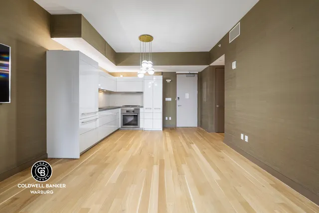a kitchen with stainless steel appliances granite countertop a stove and a refrigerator