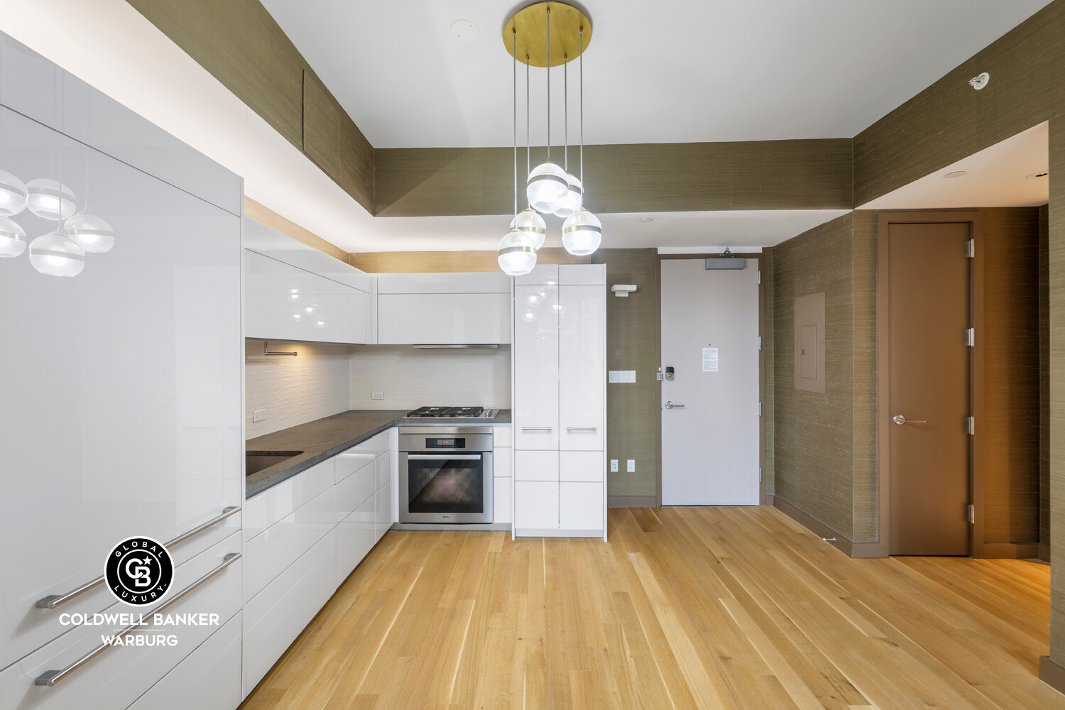 241 5th Avenue, Unit 14C Manhattan, NY 10016 - Photo 7 of 14 a kitchen with stainless steel appliances granite countertop a stove and a refrigerator