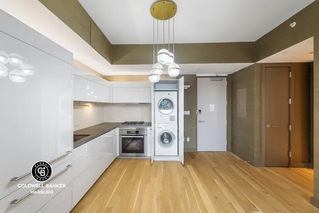 a view of a storage & utility room with a washer dryer