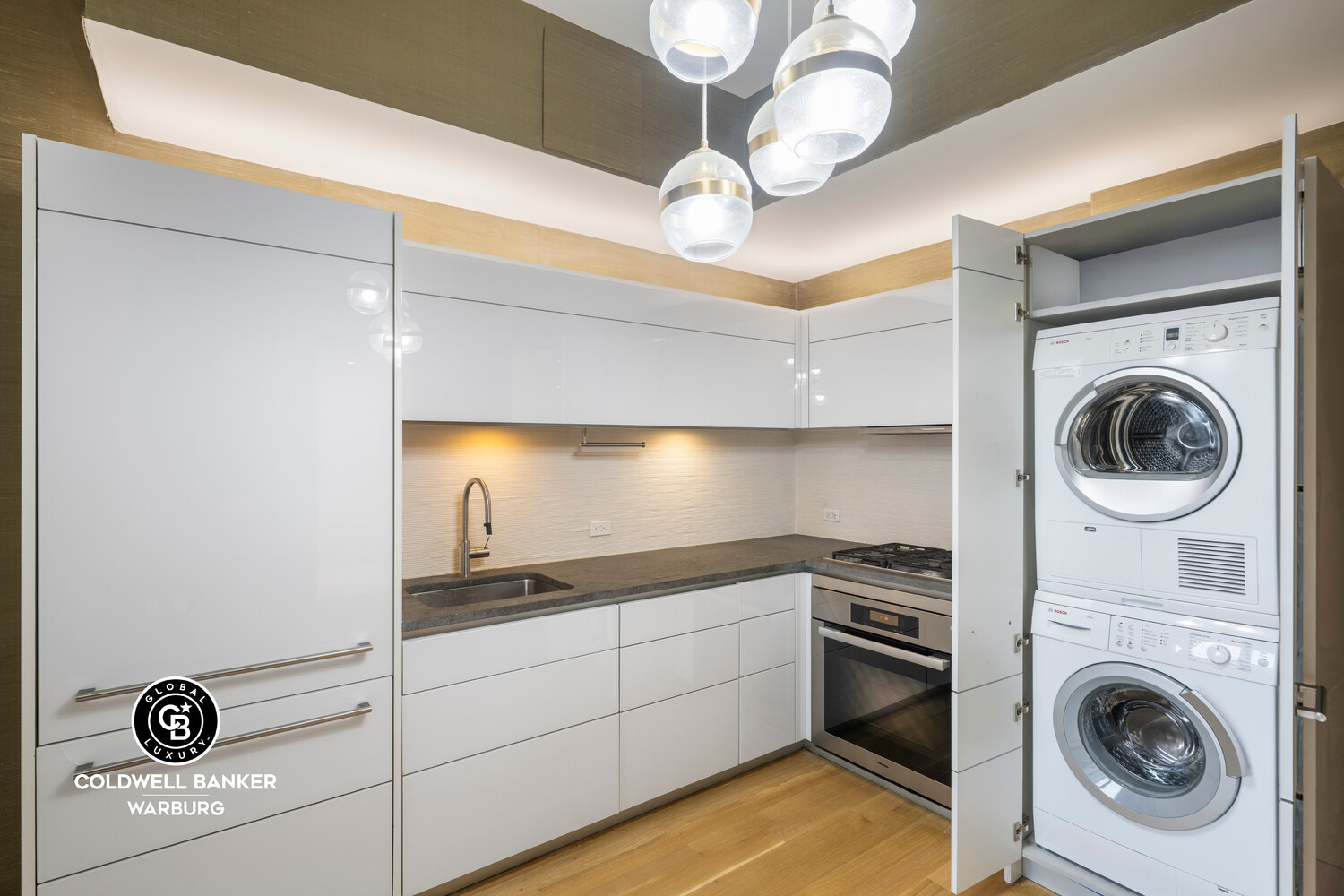 241 5th Avenue, Unit 14C Manhattan, NY 10016 - Photo 9 of 14 a view of a storage & utility room with a washer dryer