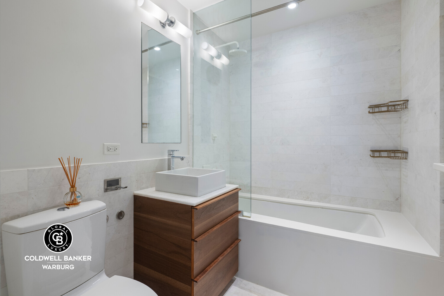 241 5th Avenue, Unit 14C Manhattan, NY 10016 - Photo 10 of 14 a bathroom with a sink a toilet and shower
