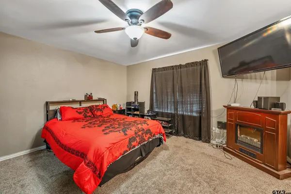 a bed sitting in a room next to a window