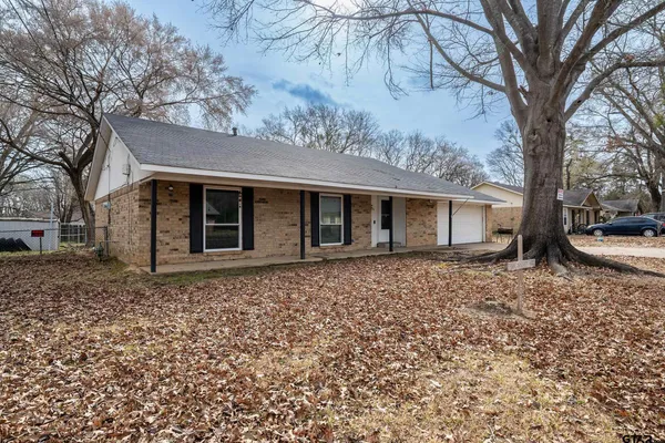 a house with trees in the background