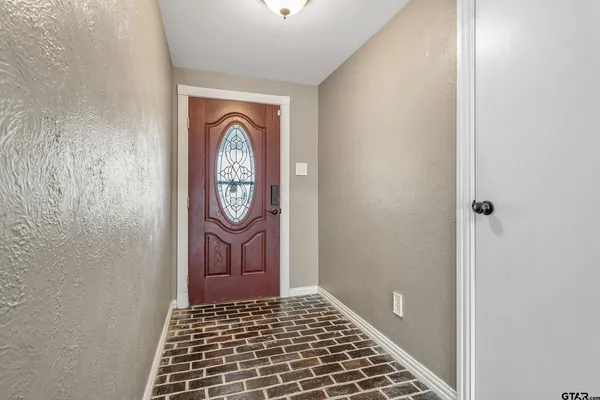 a view of an entryway with a rug