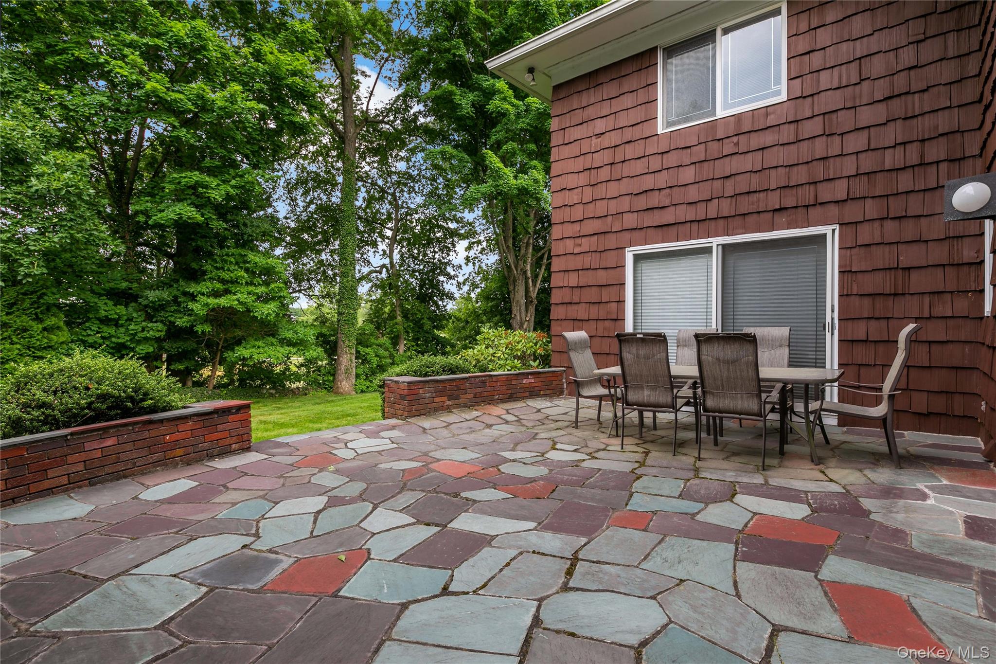 16 Meadow Road Scarsdale, NY 10583 - Photo 36 of 47 a view of a backyard with sitting area