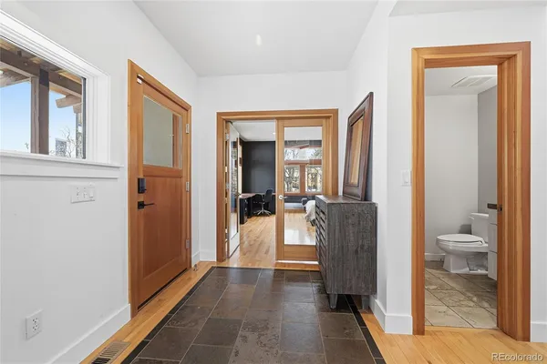 a bathroom with a tub a sink a mirror a shower and vanity