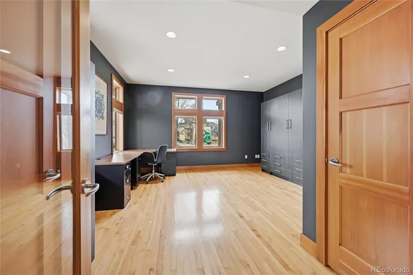 a spacious bedroom with a bed and a window