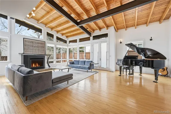 a kitchen with stainless steel appliances granite countertop a stove top oven a sink and a refrigerator